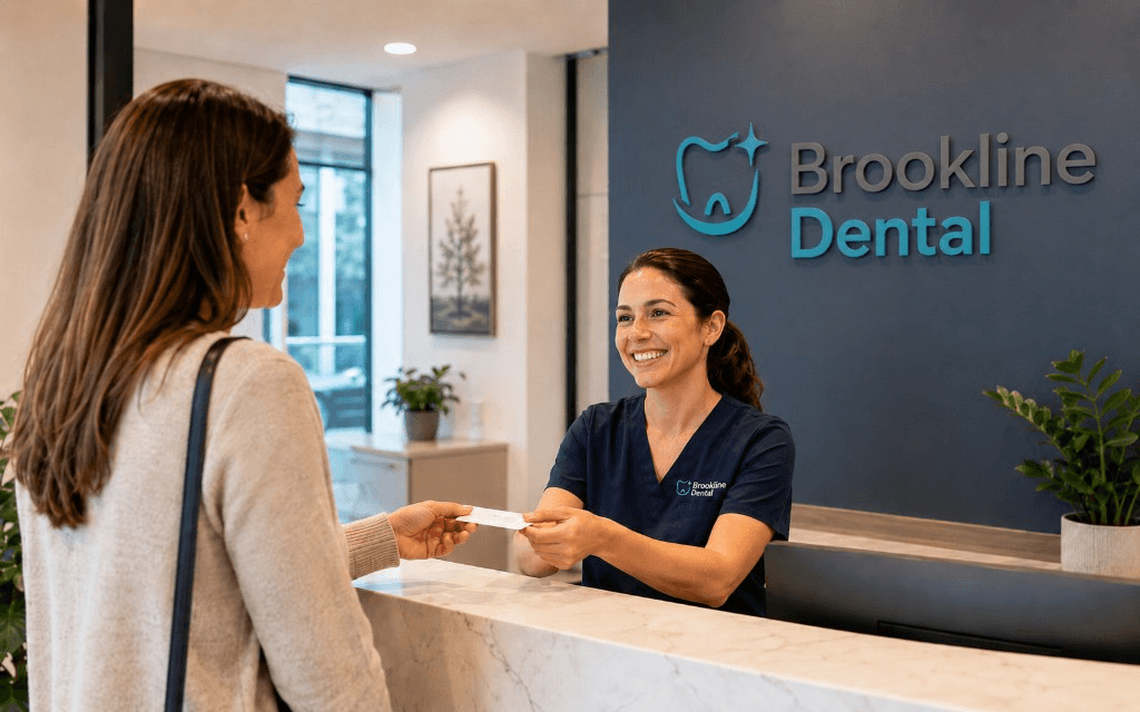 Brookline Dental reception greeting a patient at a modern front desk